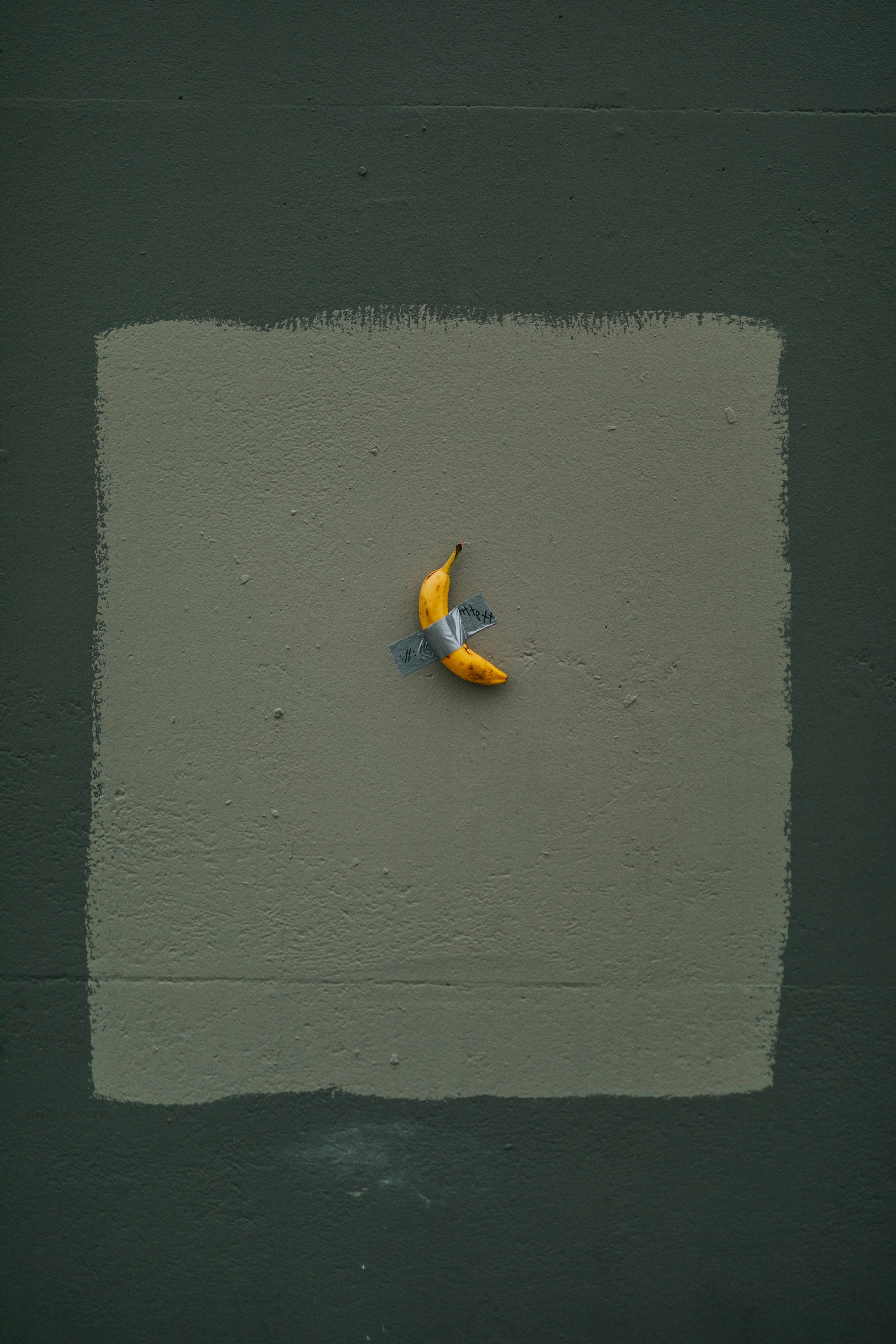 yellow banana fruit with tape